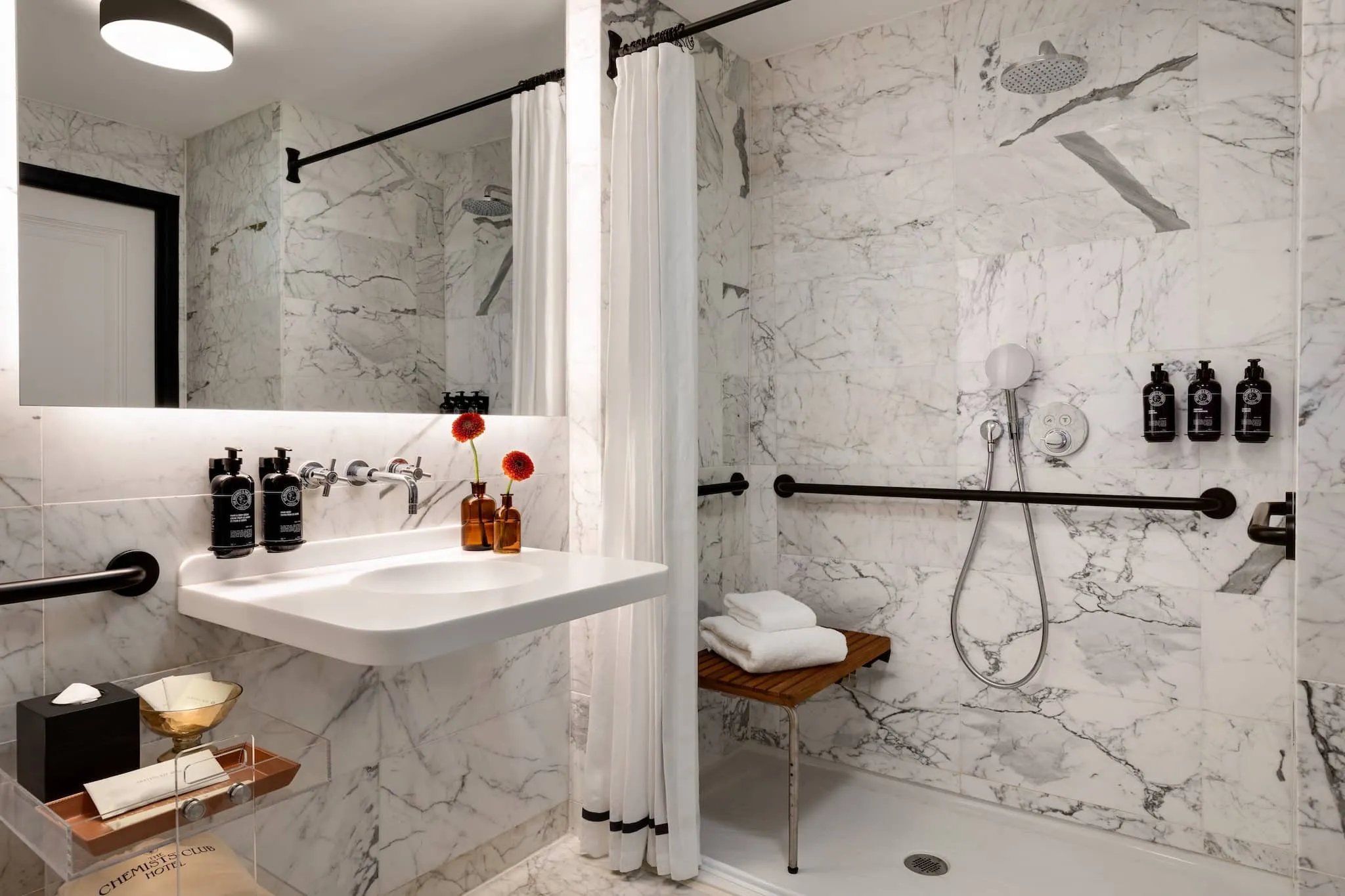 Refined bathroom design at The Chemists' Club Hotel NYC features minimalist luxury in Midtown Manhattan