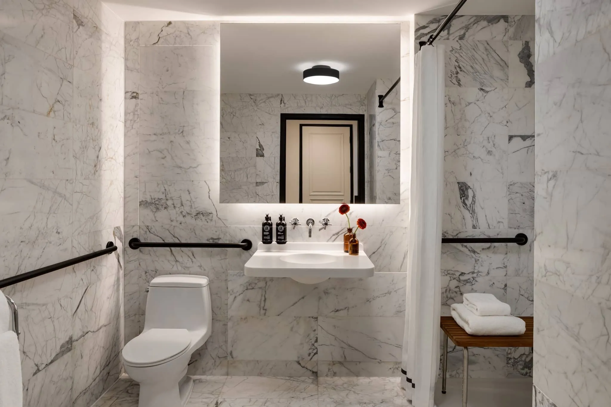 Luxury bathroom at The Chemists' Club Hotel NYC features marble surfaces and refined fixtures in Midtown