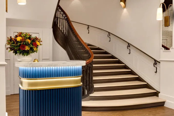 Modern staircase at The Chemists' Club Hotel showcases architectural elegance in the heart of Midtown NYC